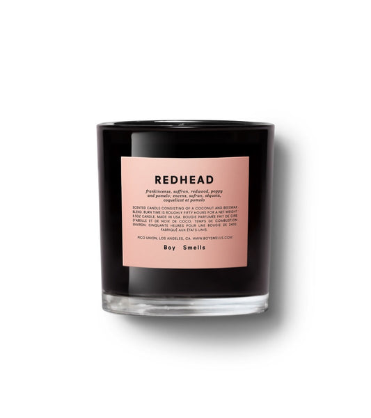 redhead boy smells candle  from flower + furbish Shop now at flower + furbish